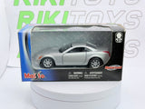 Cadillac Evoq Coupé Maisto 1/40 Argento - RikiToys - Maisto#