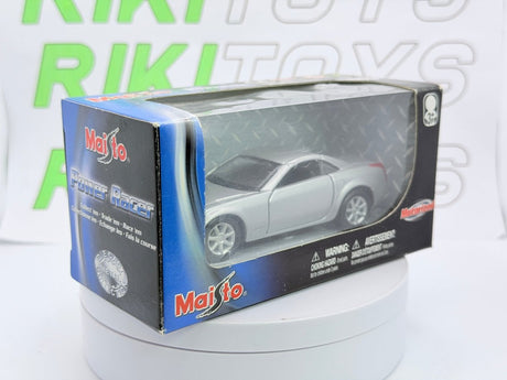 Cadillac Evoq Coupé Maisto 1/40 Argento - RikiToys - Maisto#